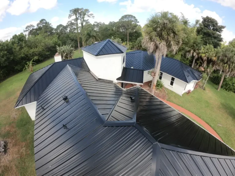 Aerial view of roofing contractor work showcasing high-quality metal roof replacement